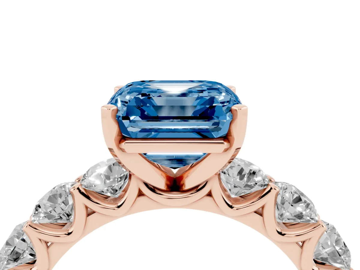 Fancy Blue Asscher Cut Diamond Prong Setting with Side Stones on a Pave Band Rose gold
