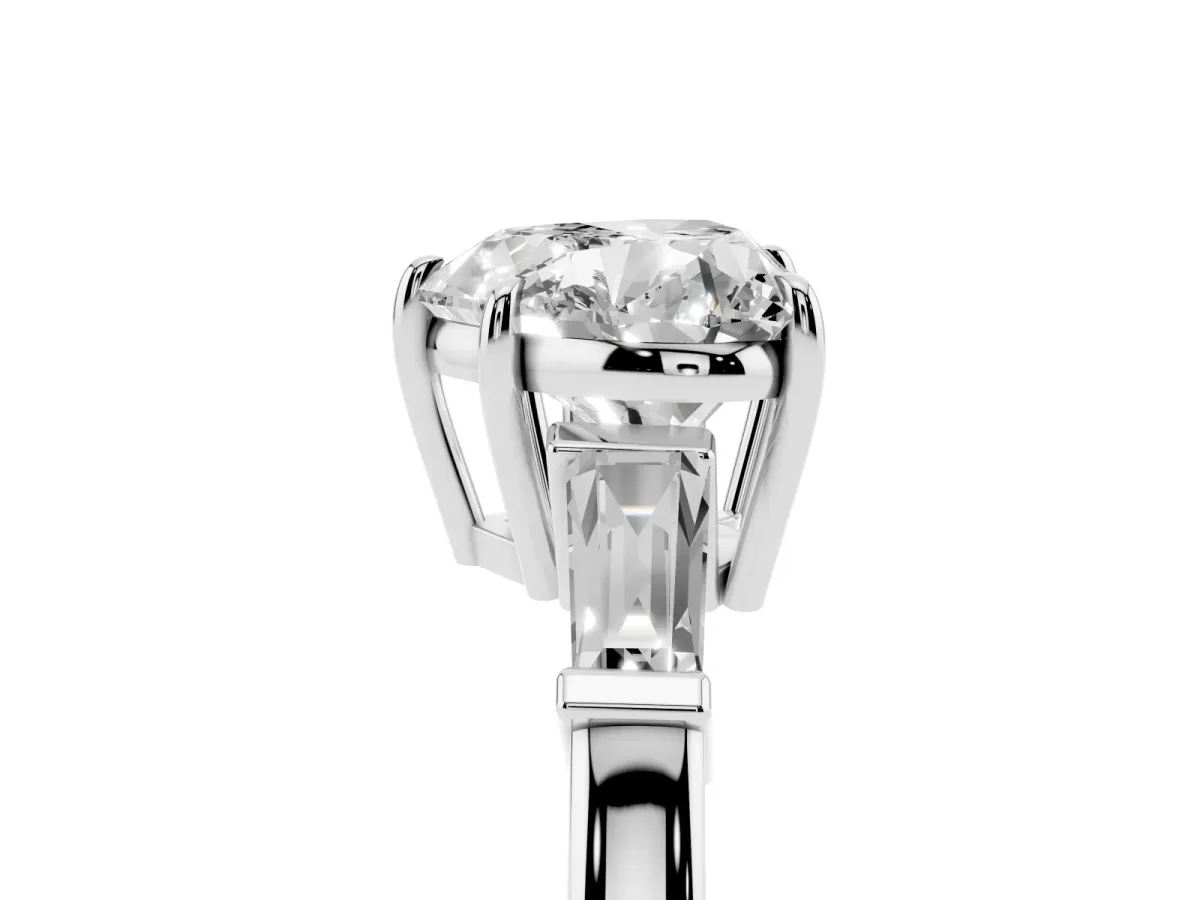 Heart Cut Diamond Three-Stone Ring with Tapered Baguette Side Stones and Prong Setting Platinum