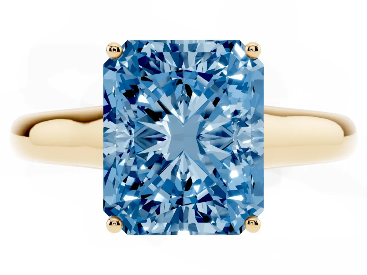 Fancy Blue Radiant Cut Solitaire Engagement Ring with Tapered Band and Four-Prong Setting Yellow gold