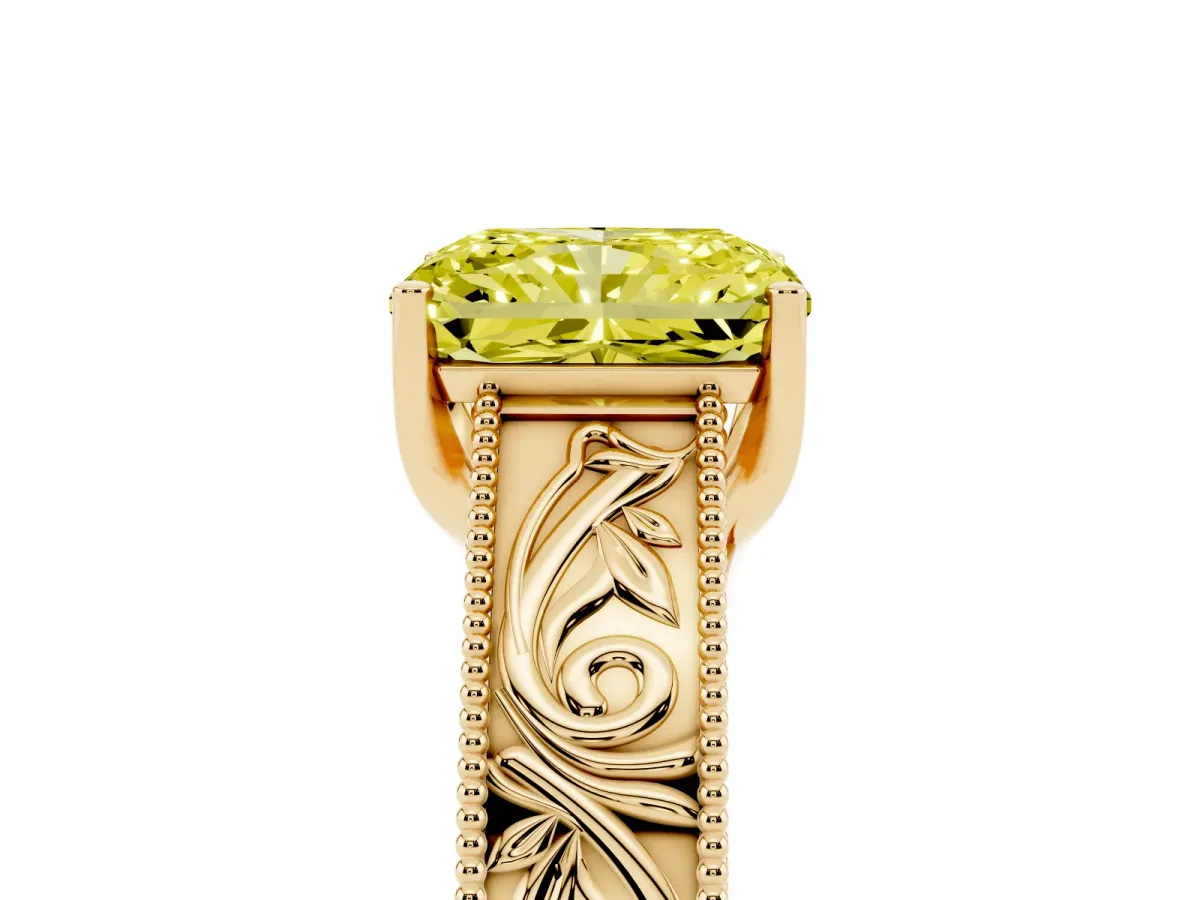 Fancy Yellow Radiant Cut Diamond Solitaire Ring with Engraved Band and Four-Prong Setting Yellow gold