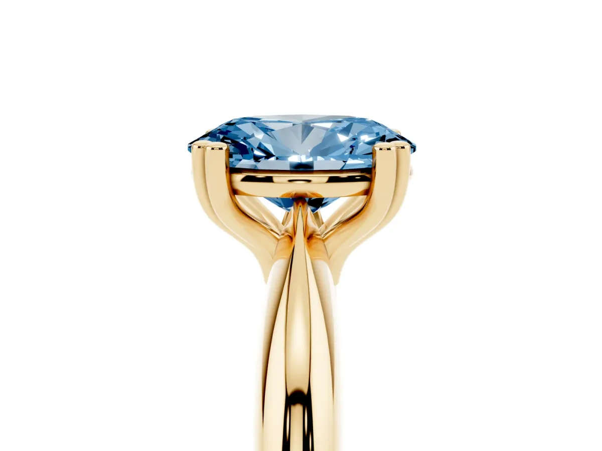 Fancy Blue Oval Cut Cut Solitaire Engagement Ring with Tapered Band and Four-Prong Setting Yellow gold