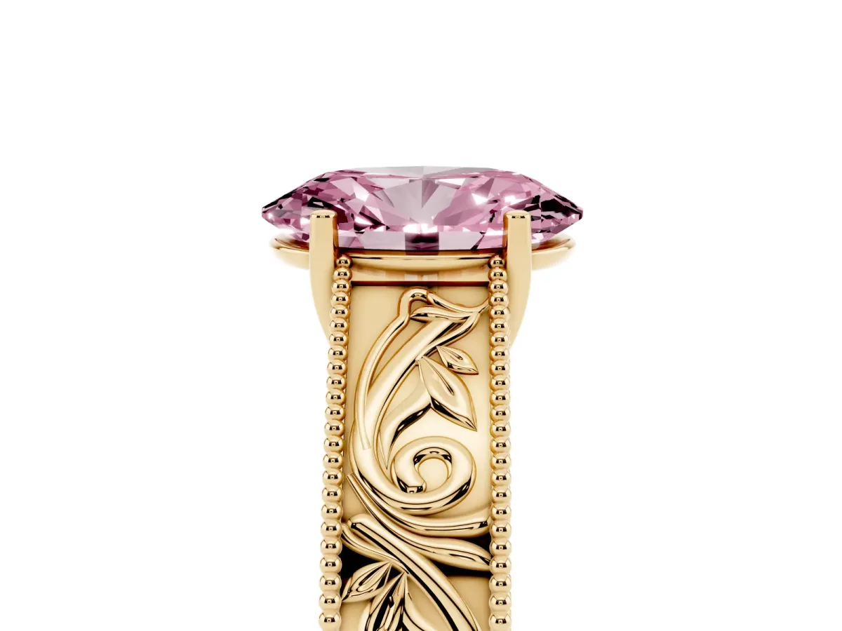 Fancy Pink Oval Cut Diamond Solitaire Ring with Engraved Band and Four-Prong Setting Yellow gold