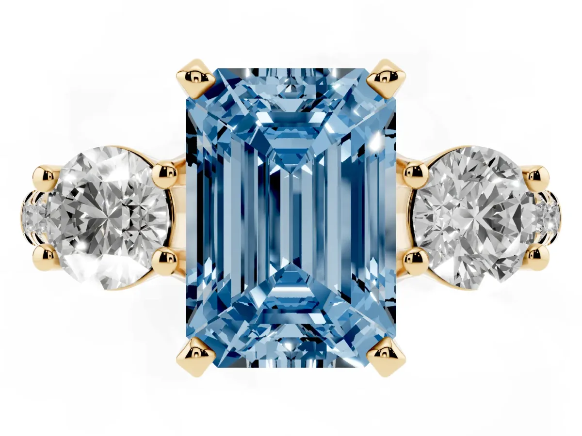Fancy Blue Three-Stone Emerald Cut Diamond Pavé Band with Four-Prong Setting Yellow gold
