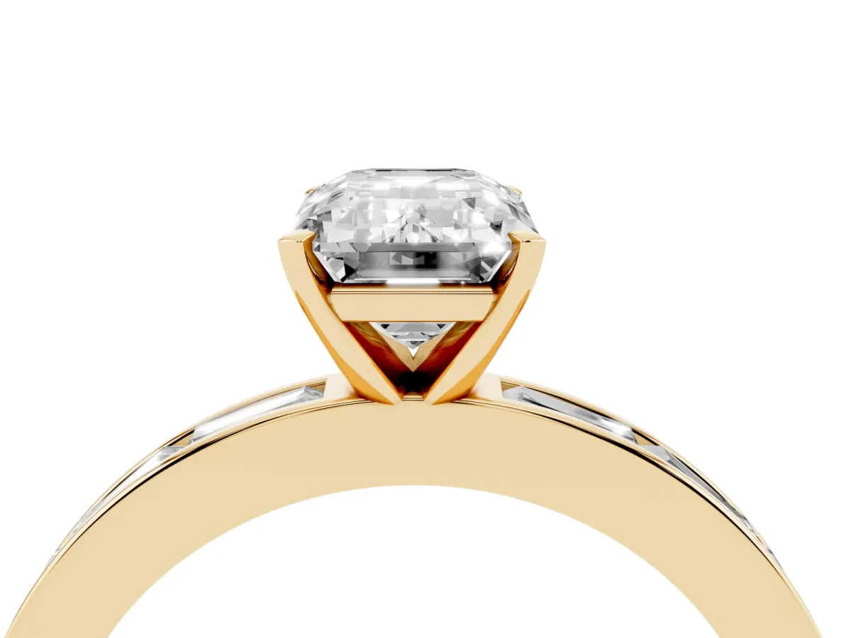 Emerald Cut Solitaire Diamond Ring with Channel-Set Baguette Band and Four-Prong Setting Yellow gold