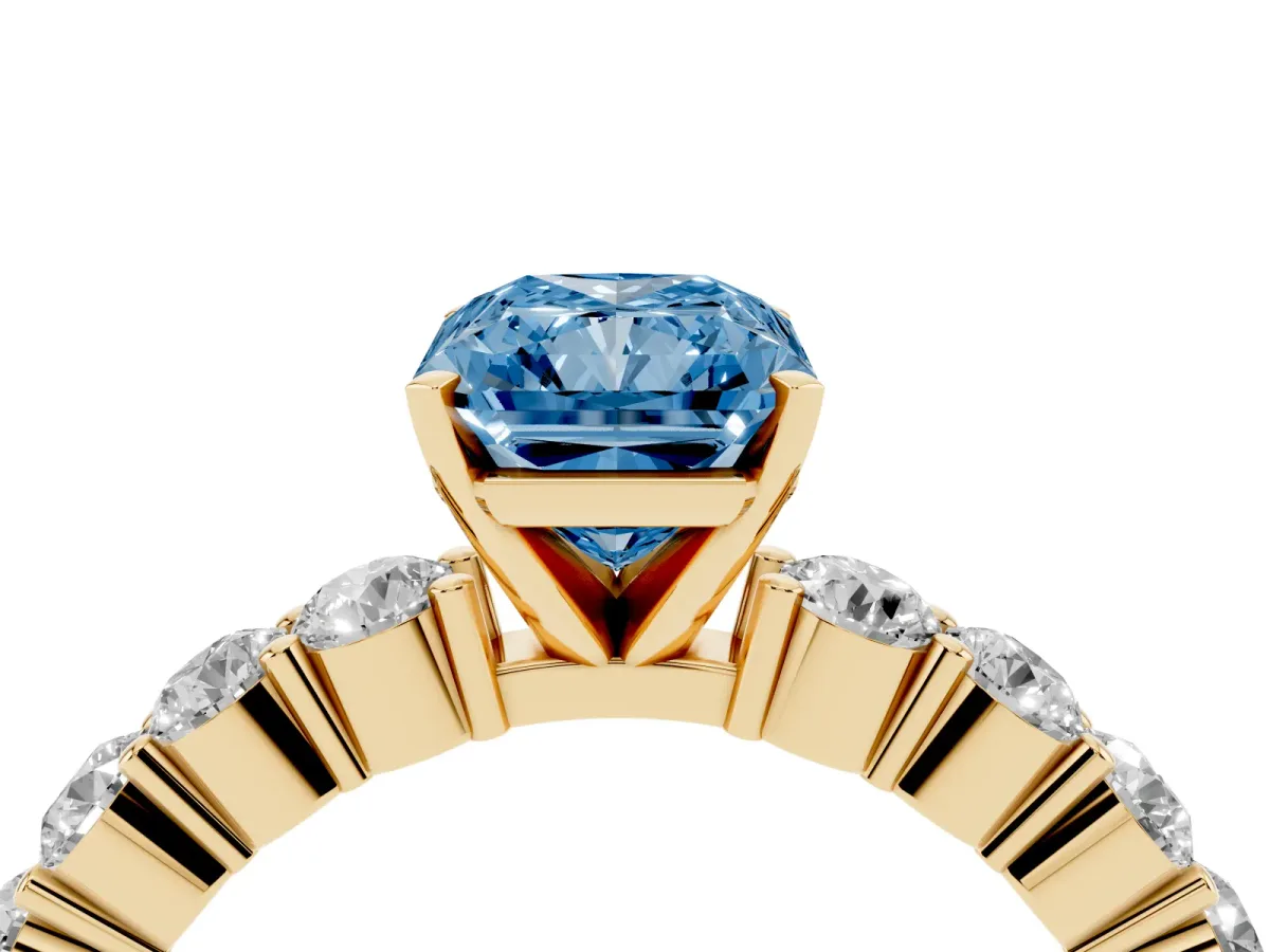 Fancy Blue Radiant Cut Diamond Solitaire Ring with Shared Prong Round Side Stones Yellow gold