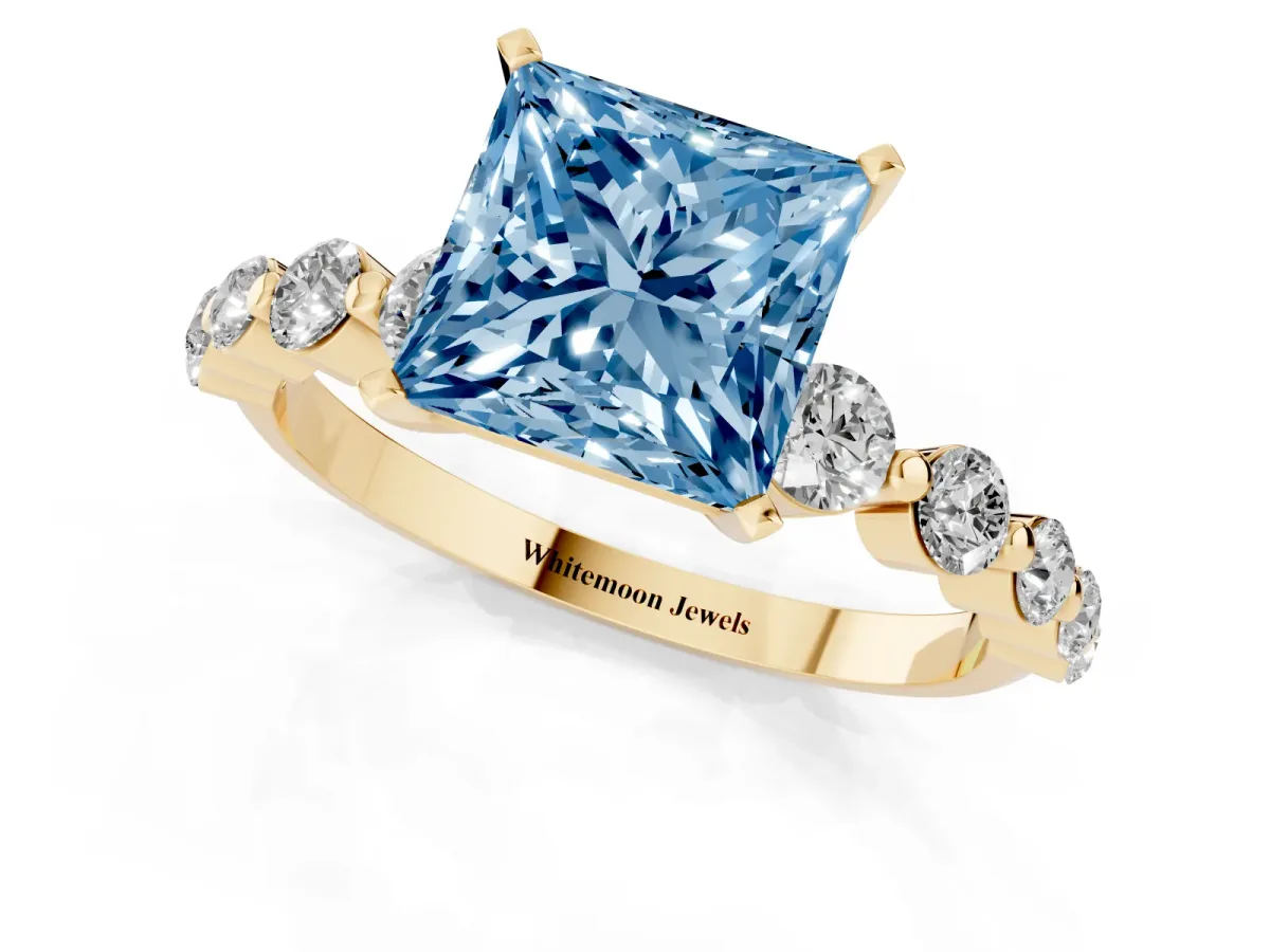 Fancy Blue Princess Cut Solitaire Diamond Ring with Pave Band and Four-Prong Setting Yellow gold