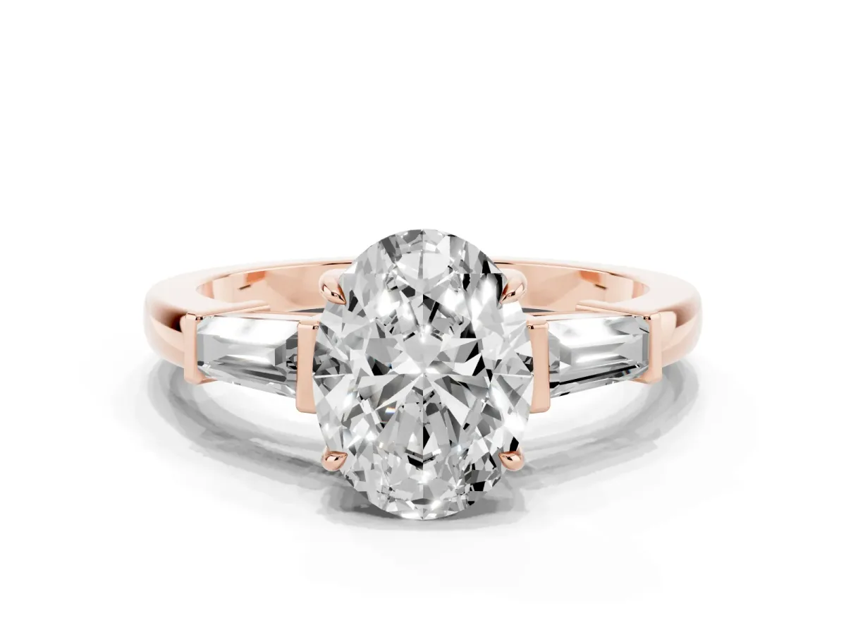 Oval Cut Diamond Three-Stone Ring with Tapered Baguette Side Stones and Prong Setting Rose gold