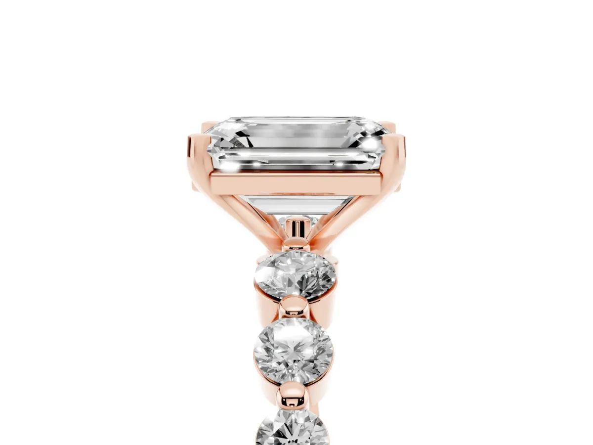 Emerald Cut Solitaire Diamond Ring with Pave Band and Four-Prong Setting Rose gold
