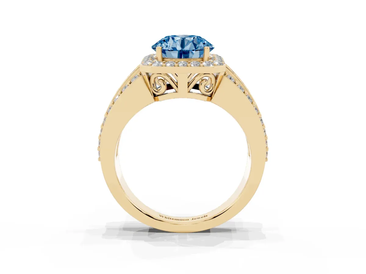 Fancy Blue Round Cut Halo Diamond Ring with Round Split Shank and Prong Setting Yellow gold