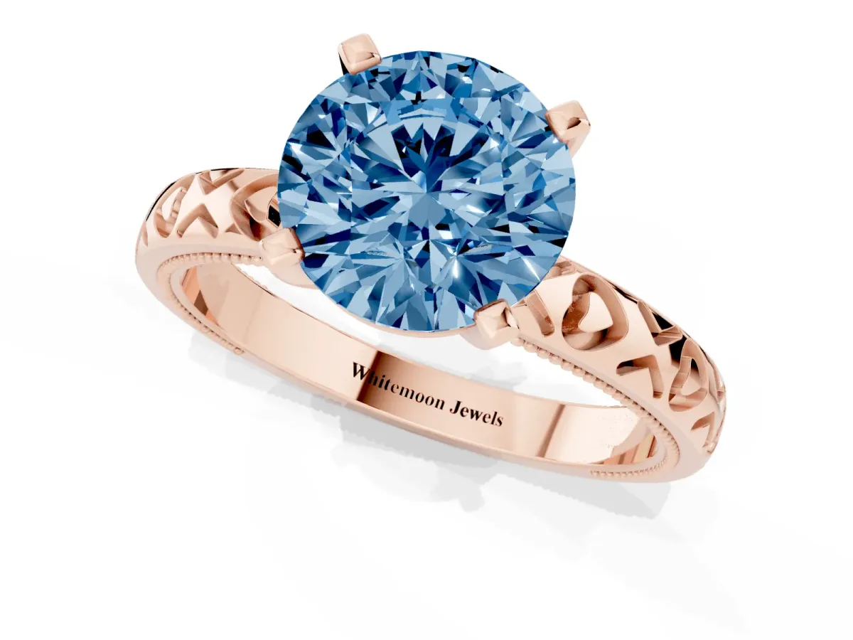 Fancy Blue Round Cut Solitaire Diamond Engagement Ring with XO Engraved Band and Four-Prong Setting Rose gold