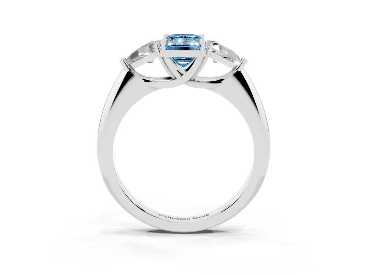 Fancy Blue Three-Stone Emerald Cut Diamond Engagement Ring with Trillion Side Stones and Prong Setting Silver