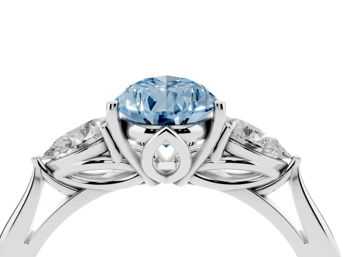 Fancy Blue Three-Stone Pear Cut Diamond Ring with Pear Side Stones in Four-Prong Setting Platinum