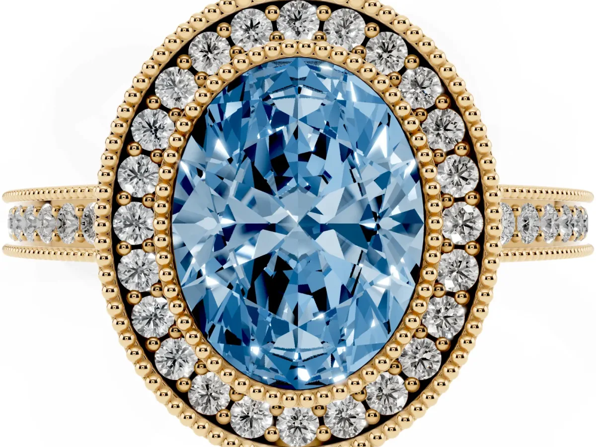 Fancy Blue Oval Cut Cut Halo Diamond Ring with Pavé Band and Milgrain Prong Setting Yellow gold