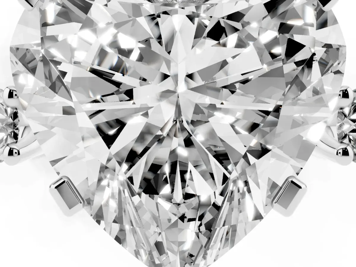 Heart Cut Cut Three-Stone Solitaire Ring with Round Accent Diamonds and Four-Prong Setting Silver