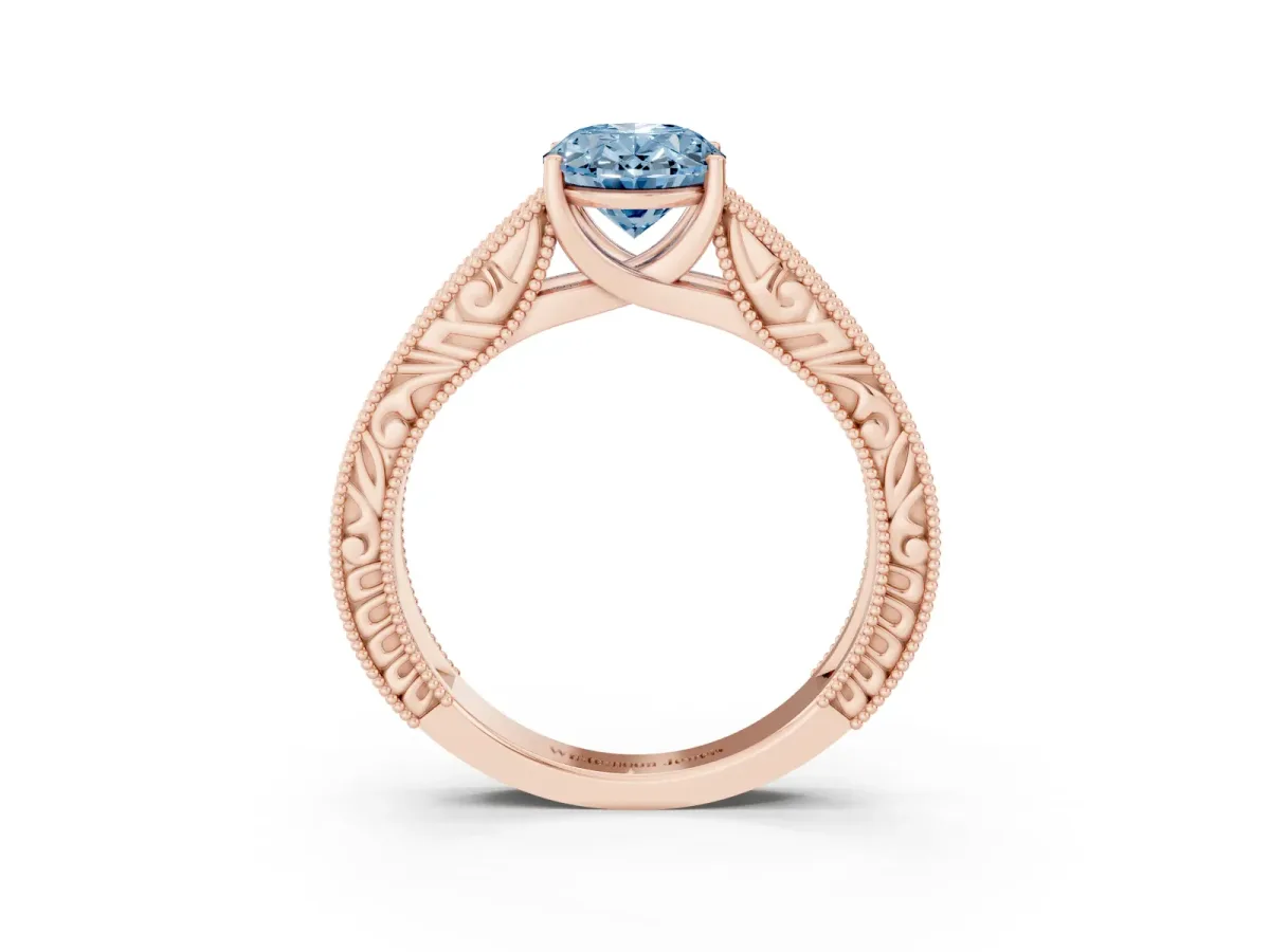 Fancy Blue Oval Cut Diamond Solitaire Ring with Engraved Band and Four-Prong Setting Rose gold