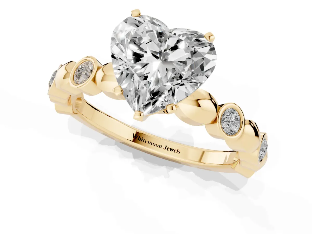 Heart Cut Solitaire Bezel-Set Diamond Ring with Beaded Band and Four-Prong Setting Yellow gold