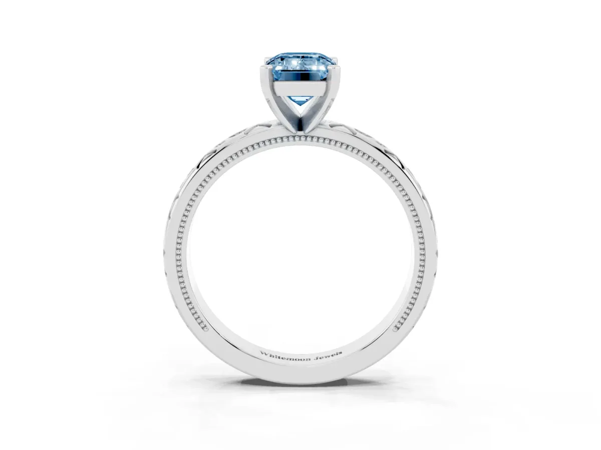 Fancy Blue Emerald Cut Solitaire Engagement Ring with Scrollwork Band and Four-Prong Setting White gold