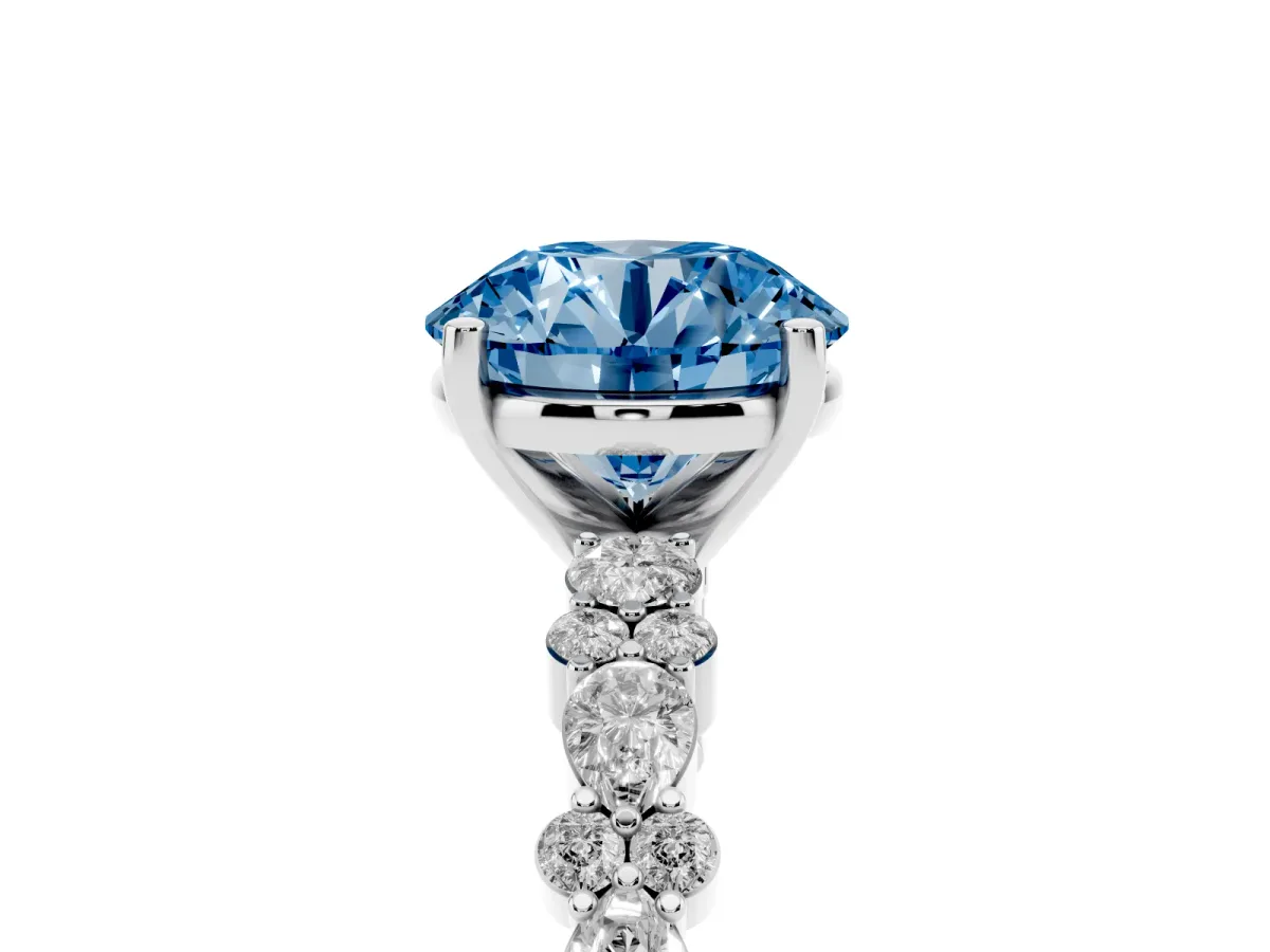 Fancy Blue Round Cut Diamond Side Stone Solitaire Ring with Round and Four-Prong Setting Silver
