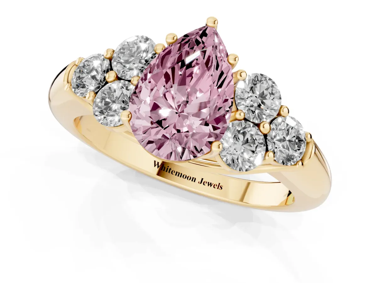 Fancy Pink Pear Cut Cut Diamond Cluster Ring with Round Accent Stones and Prong Setting on a Classic Band Yellow gold