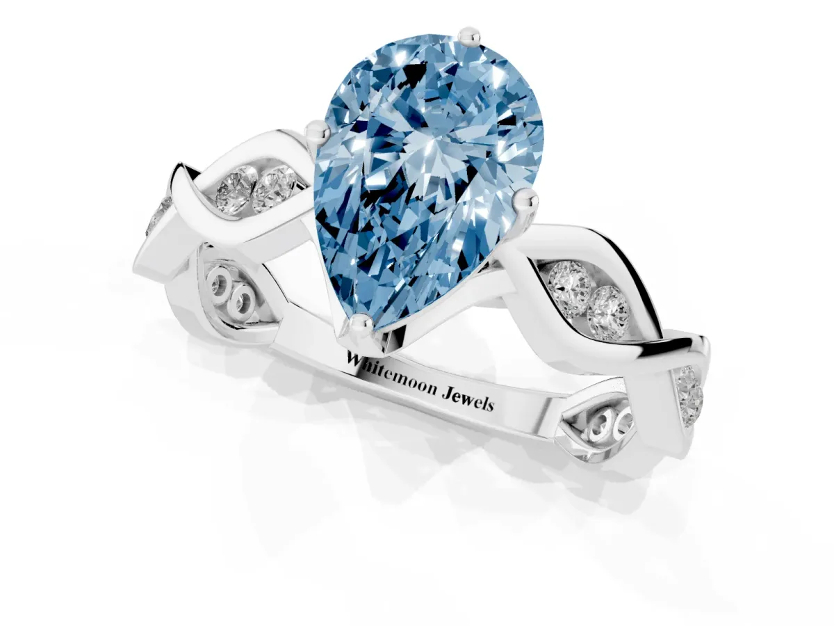 Fancy Blue Pear Cut Solitaire Twist Band with Leaf Prong Setting Silver