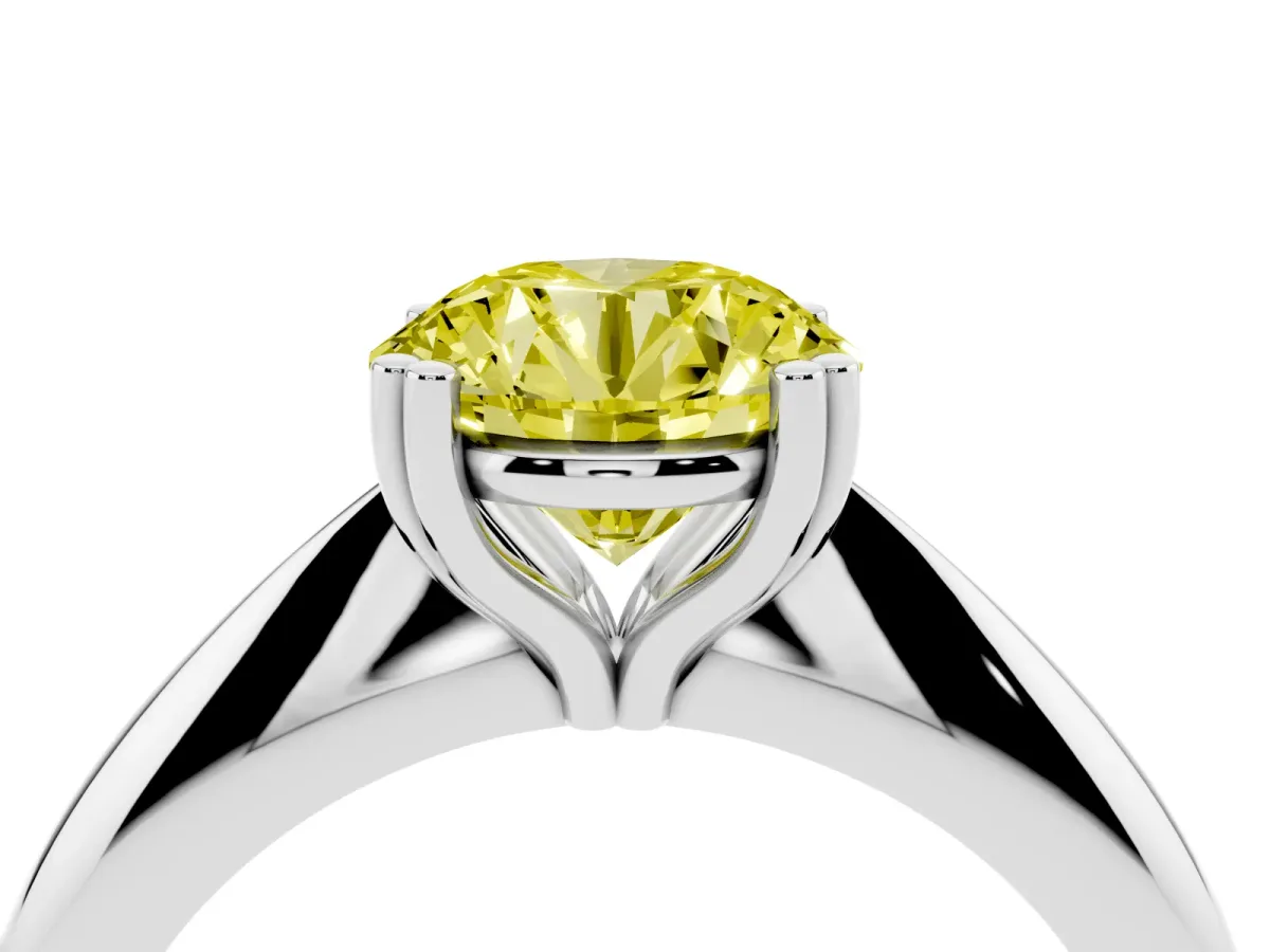 Fancy Yellow Round Cut Cut Solitaire Engagement Ring with Tapered Band and Four-Prong Setting Silver
