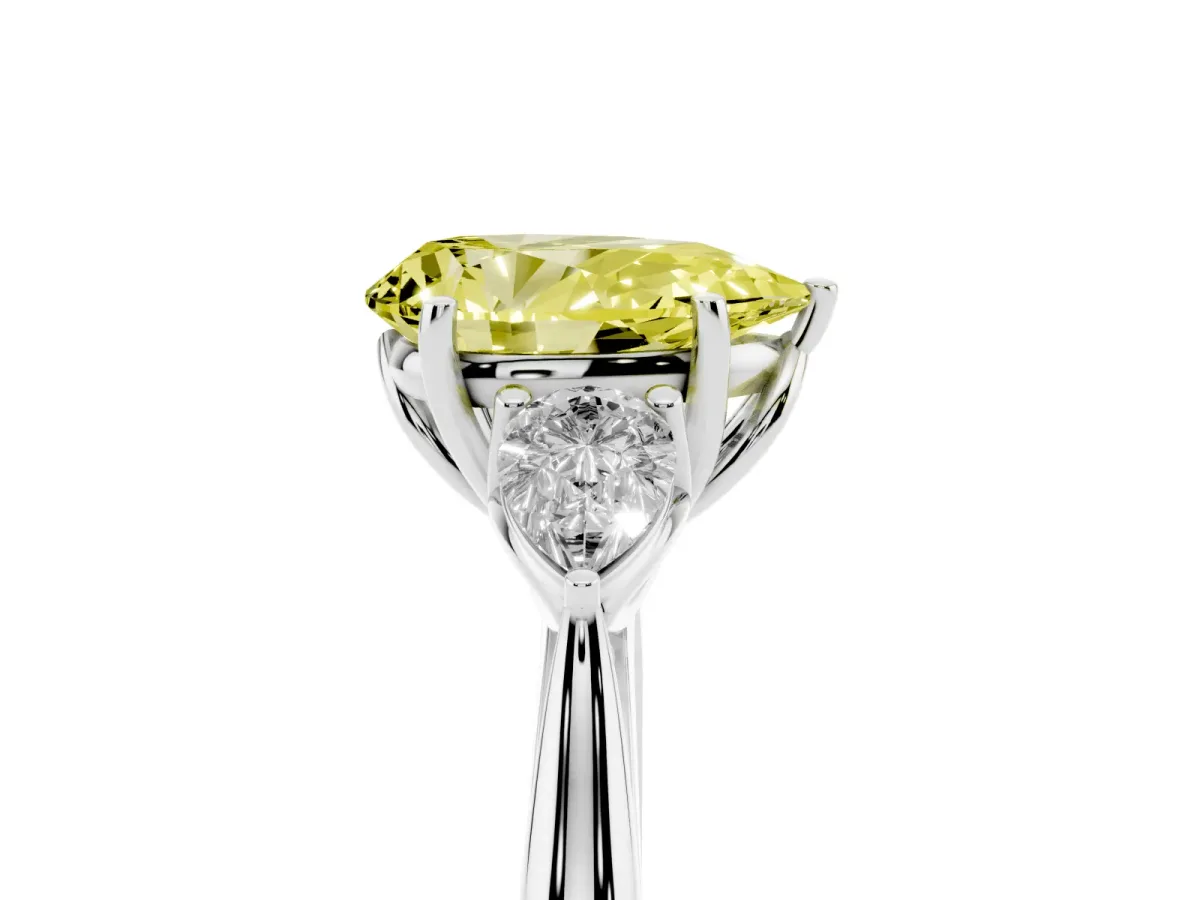 Fancy Yellow Three-Stone Pear Cut Diamond Ring with Pear Side Stones in Four-Prong Setting Platinum