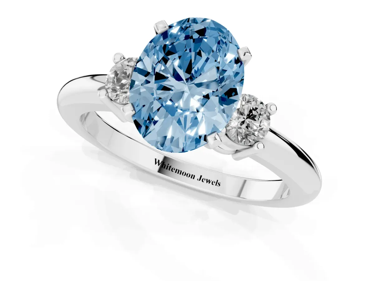 Fancy Blue Three-Stone Oval Cut Cut Diamond Solitaire with Prong Setting and Classic Band Platinum