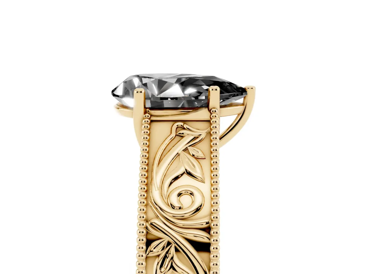 Fancy Black Pear Cut Diamond Solitaire Ring with Engraved Band and Four-Prong Setting Yellow gold