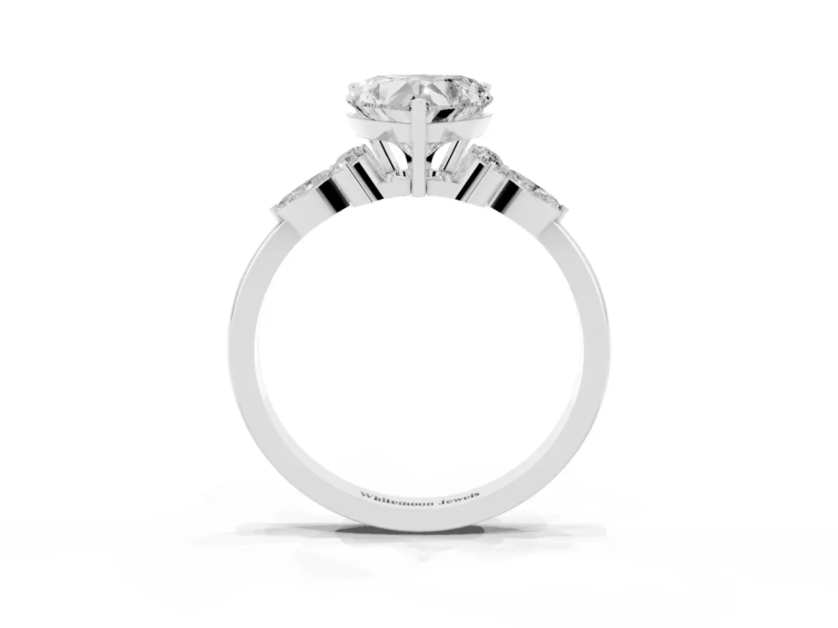 Heart Cut Brilliant Diamond Solitaire Ring with Pear Side Stones and Four-Prong Setting Platinum