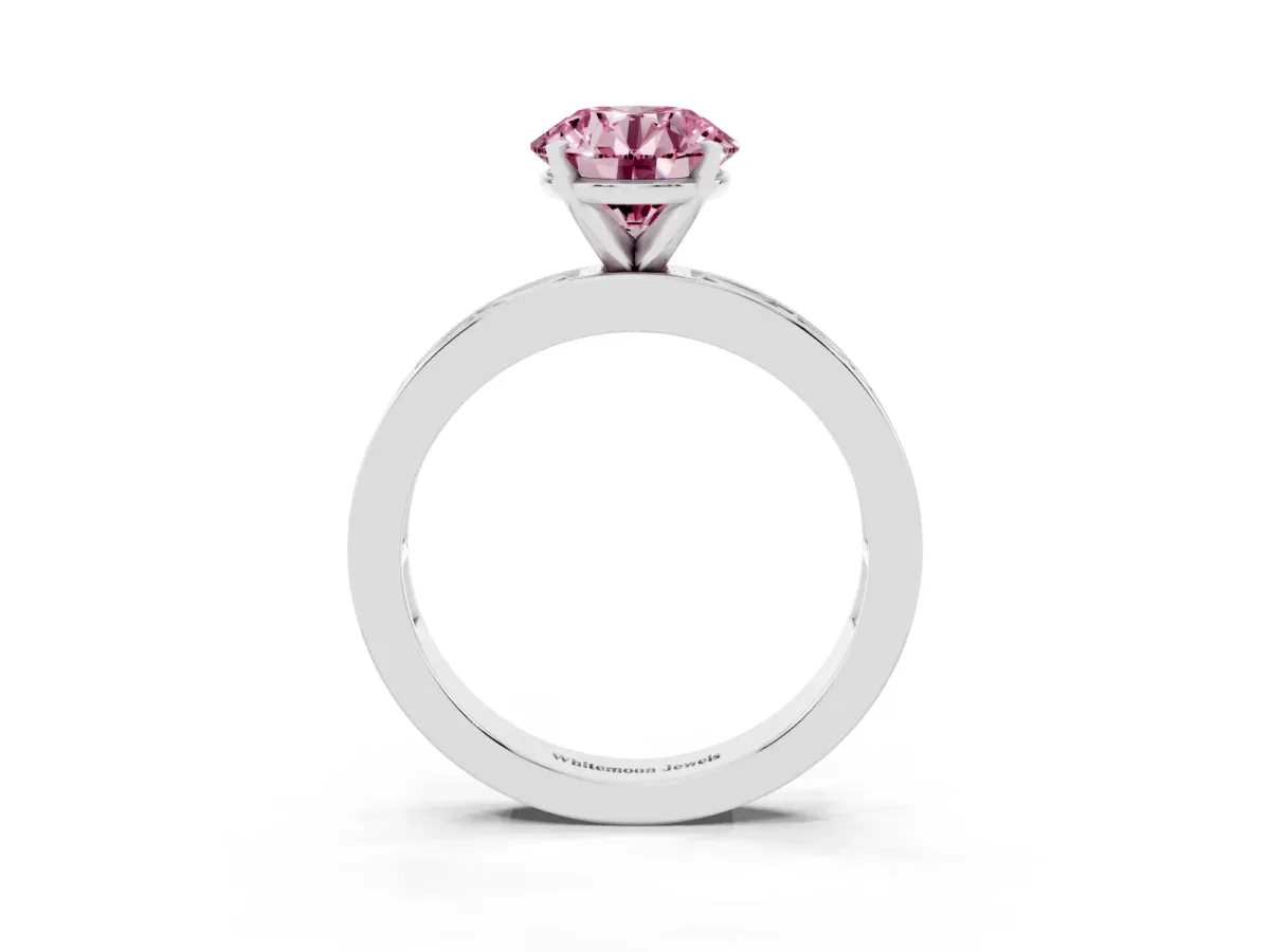 Fancy Pink Round Cut Solitaire Diamond Ring with Channel-Set Baguette Band and Four-Prong Setting Silver
