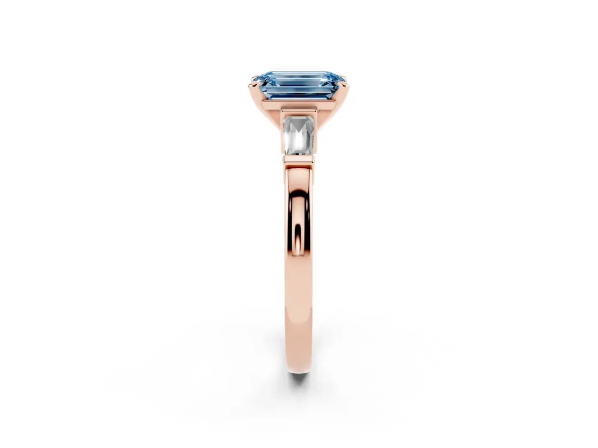 Fancy Blue Emerald Cut Cut Diamond Solitaire Ring with Tapered Baguette Accents and Four-Prong Setting Rose gold