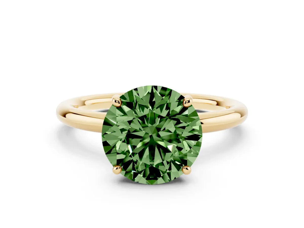 Fancy Green Round Cut Solitaire Diamond Ring with Four-Prong Setting on a Plain Band Yellow gold