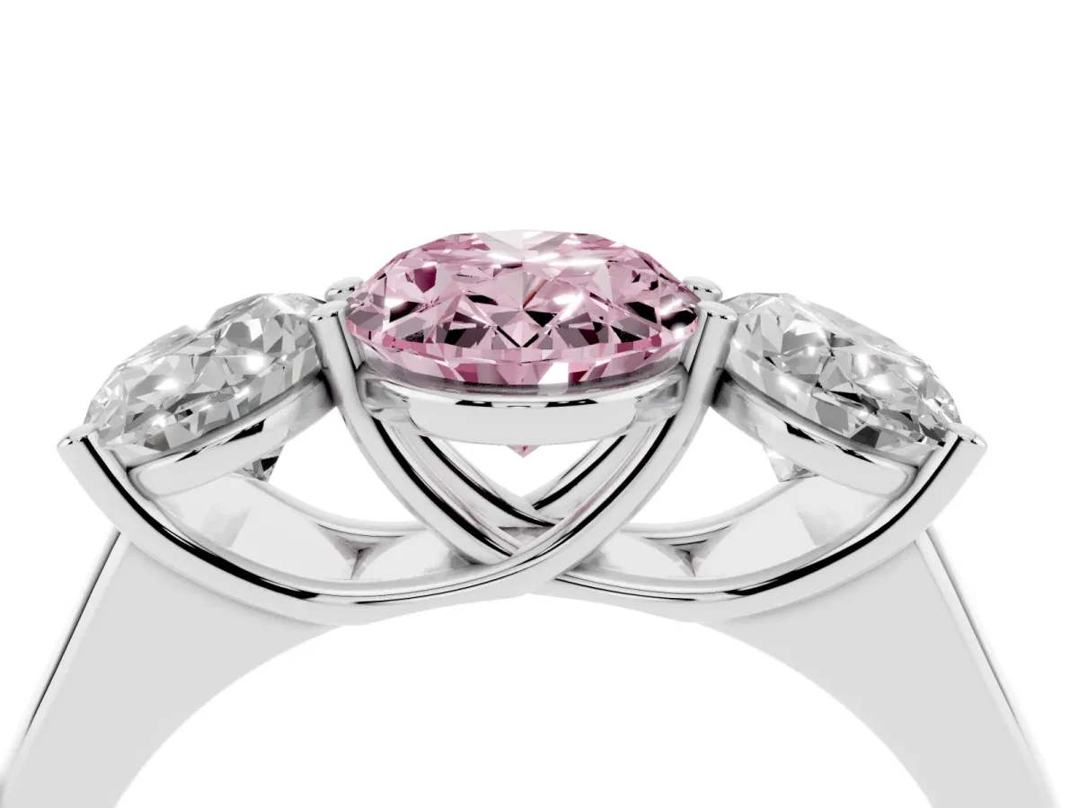 Fancy Pink Oval Cut Three-Stone Diamond Ring with Prong Setting on a Classic Band Platinum
