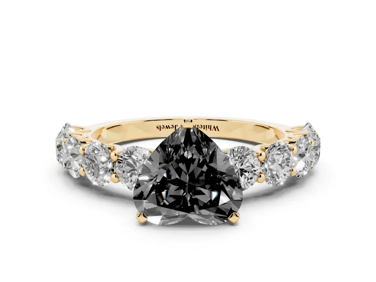 Fancy Black Heart Cut Diamond Prong Setting with Side Stones on a Pave Band Yellow gold