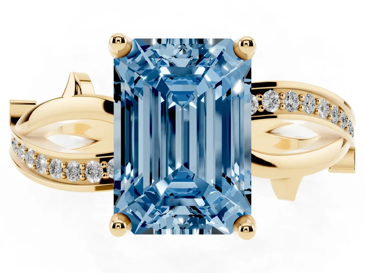 Fancy Blue Emerald Cut Solitaire Twist Band with Pavé Accents and Four-Prong Setting Yellow gold