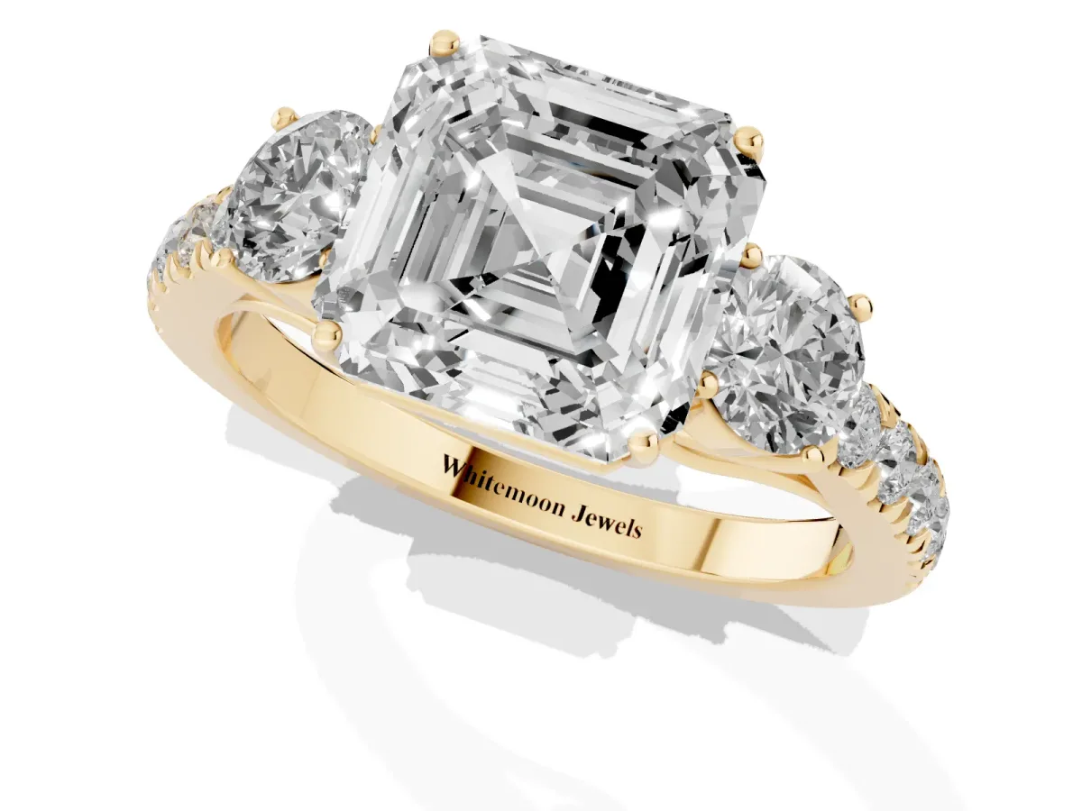 Asscher Cut Cut Diamond Three-Stone Ring with Round Side Stones and Pavé Band Yellow gold