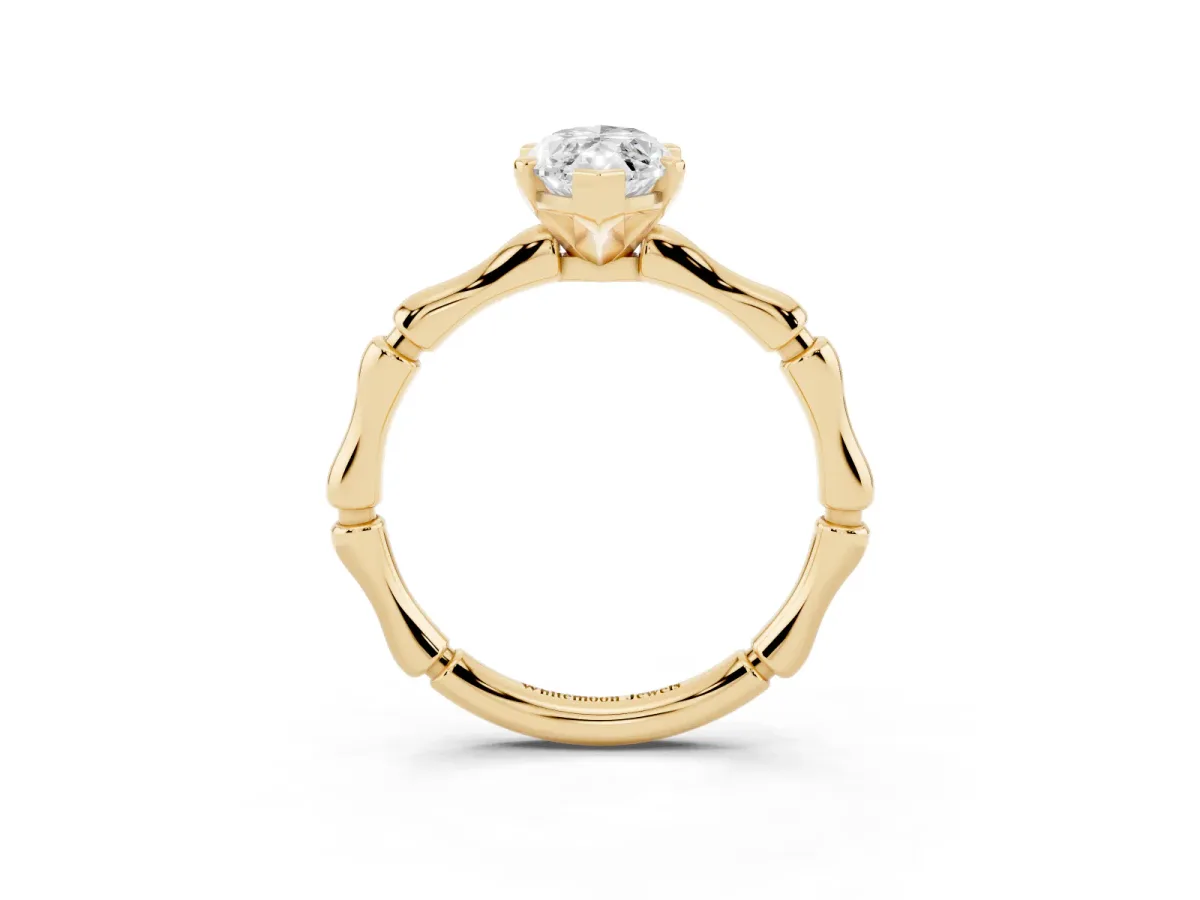 Marquise Cut Solitaire Diamond Ring with Bamboo Band and Four-Prong Setting Yellow gold