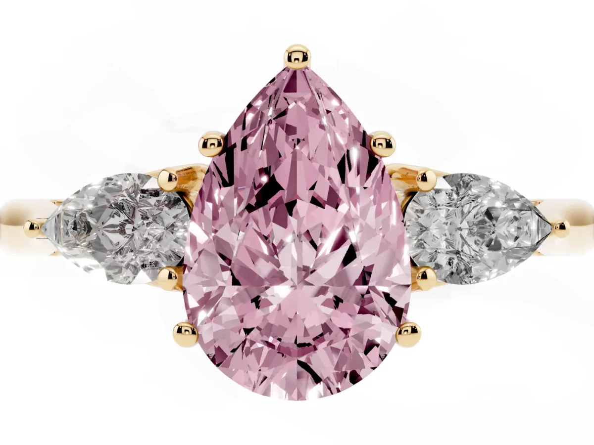 Fancy Pink Three-Stone Pear Cut Diamond Ring with Pear Side Stones in Four-Prong Setting Yellow gold