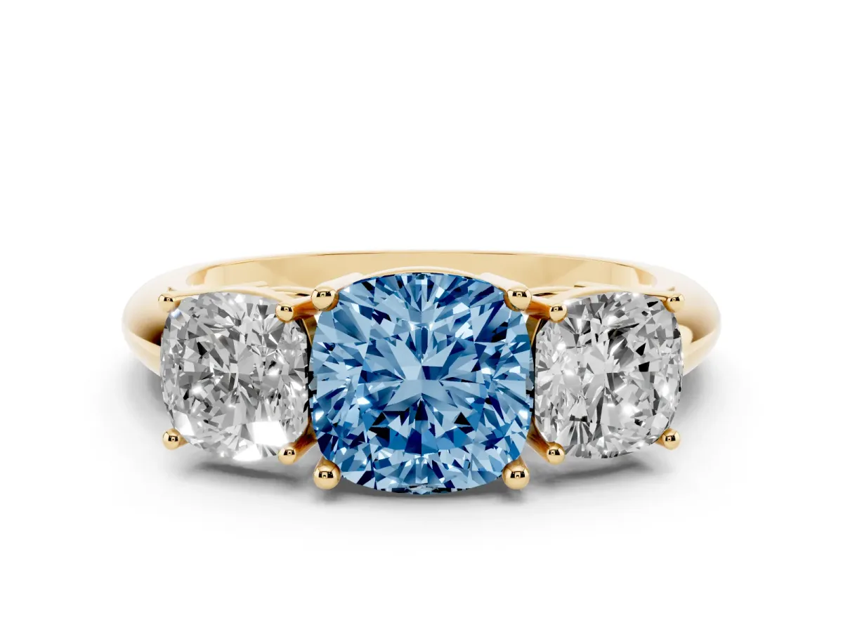 Fancy Blue Three-Stone Cushion Cut Cut Diamond Engagement Ring with Prong Setting on a White Gold Band Yellow gold
