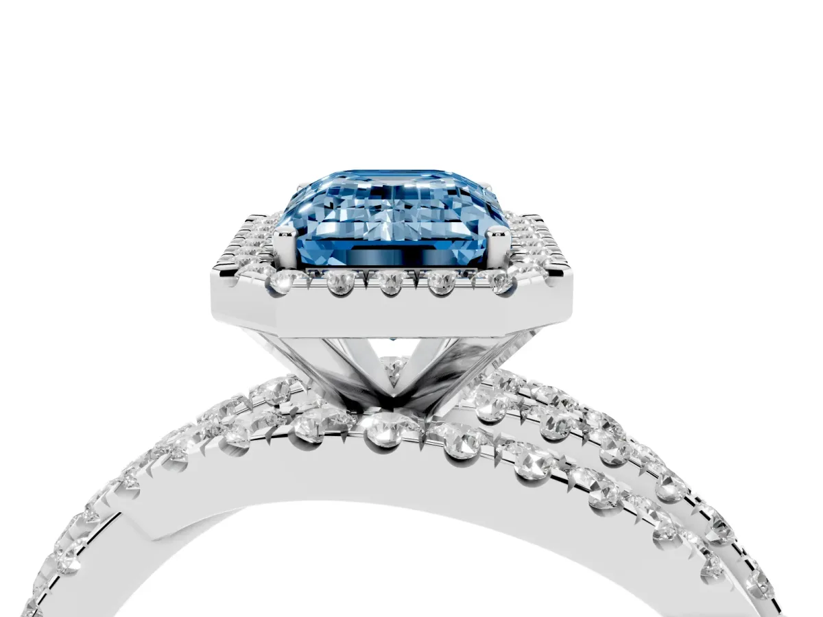 Fancy Blue Emerald Cut Diamond Halo Ring with Round Split Shank and Prong Setting Platinum
