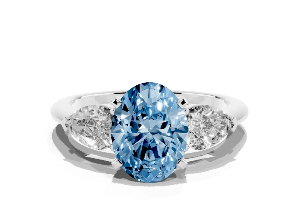 Fancy Blue Three-Stone Oval Cut Diamond Ring with Pear Side Stones and Four-Prong Setting Platinum