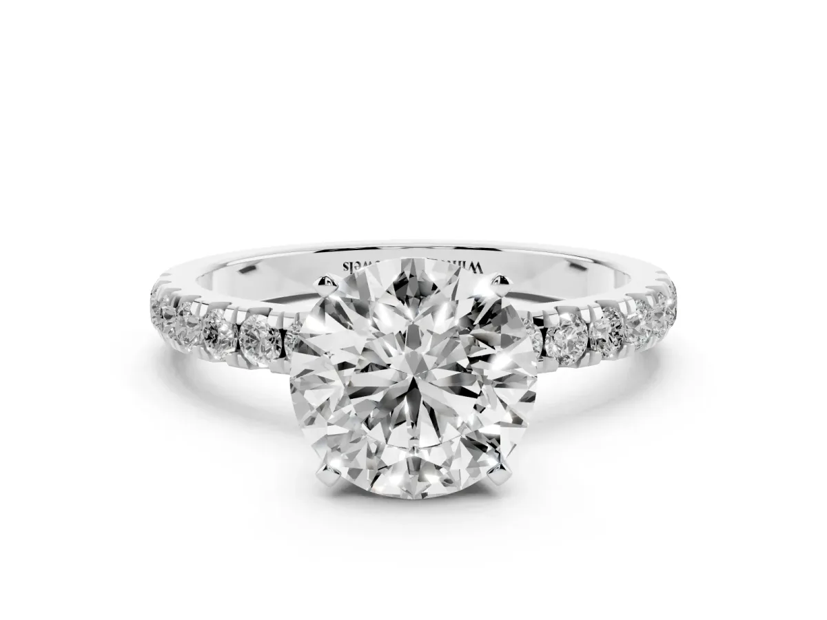Round Cut Diamond Solitaire Ring with Pavé Accents and Four-Prong Setting Silver