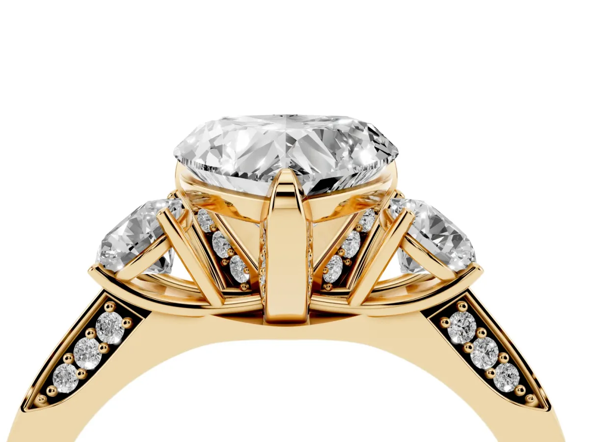 Heart Cut Brilliant Three-Stone Diamond Ring with Pavé Band and Four-Prong Setting Yellow gold