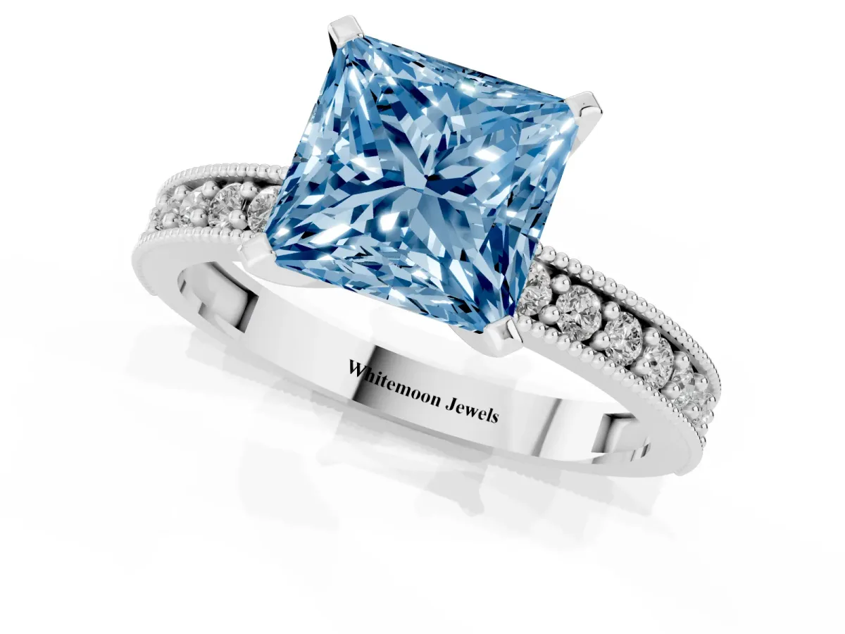 Fancy Blue Princess Cut Diamond Milgrain Pavé Engagement Ring with Four-Prong Setting Silver