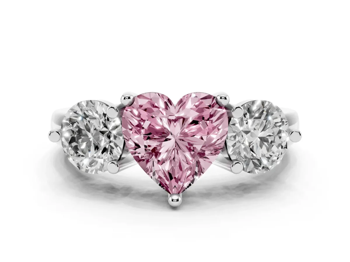 Fancy Pink Three-Stone Heart Cut Brilliant Cut Solitaire Ring with Prong Setting on a Classic Band White gold