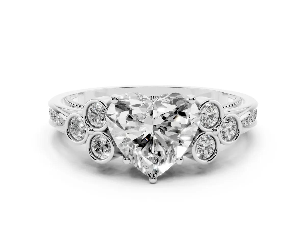 Heart Cut Cut Diamond Engagement Ring with Bezel Set Round Side Stones and Prong Setting Silver