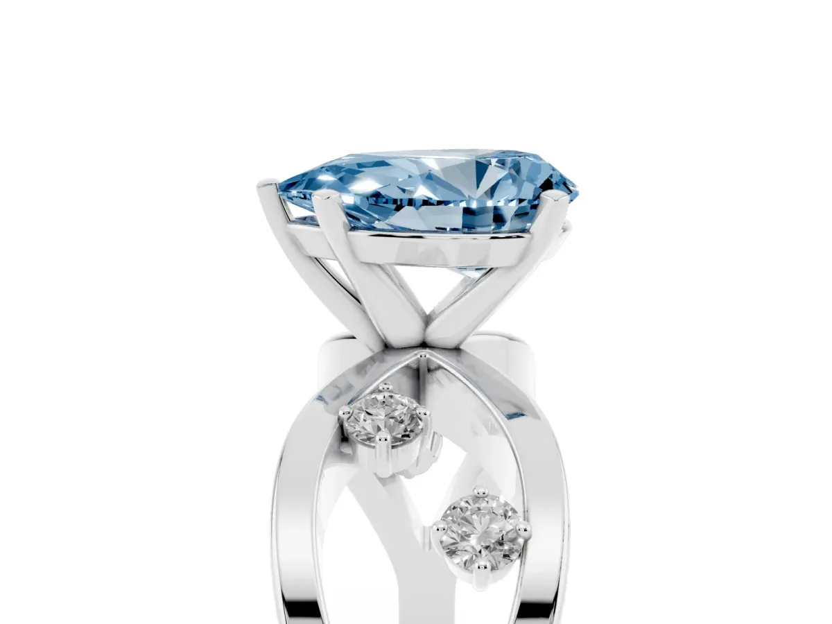 Fancy Blue Pear Cut Cut Solitaire Diamond with Side Stones on Criss-Cross Band and Four-Prong Setting Silver