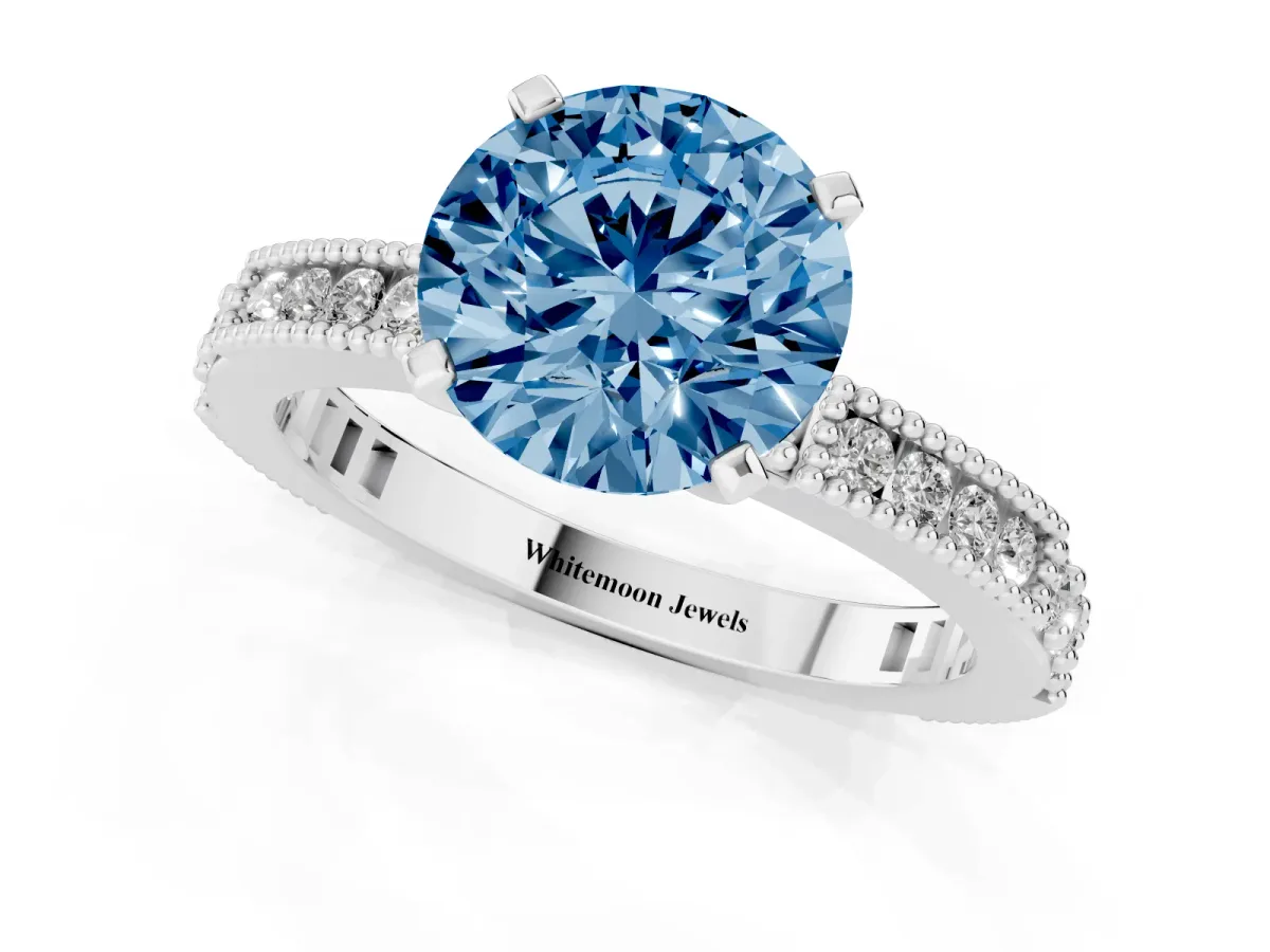 Fancy Blue Round Cut Solitaire with Pavé Band and Four-Prong Setting Platinum
