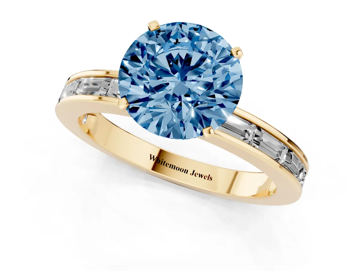 Fancy Blue Round Cut Solitaire Diamond Ring with Channel-Set Baguette Band and Four-Prong Setting Yellow gold