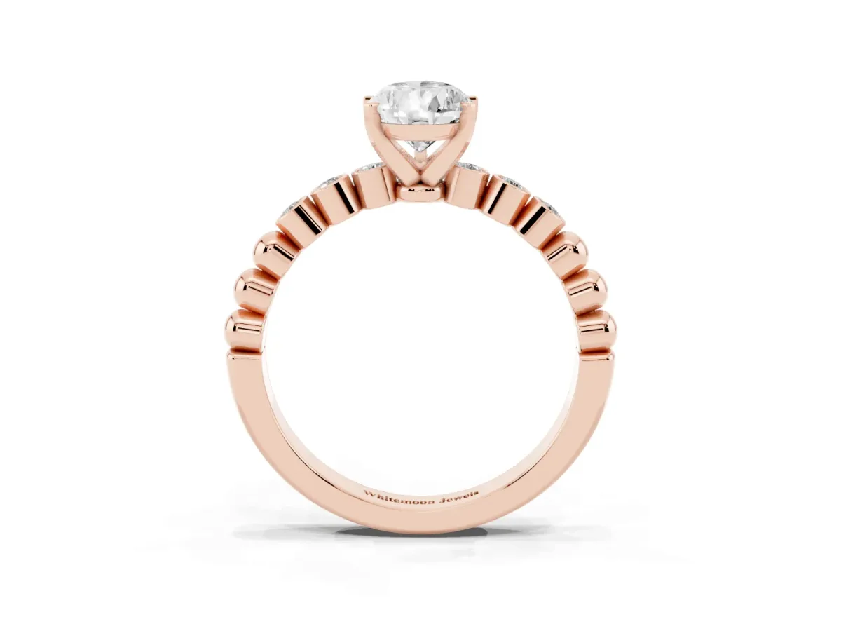 Pear Cut Solitaire Bezel Accent Diamond Engagement Ring with Beaded Band and Four-Prong Setting Rose gold